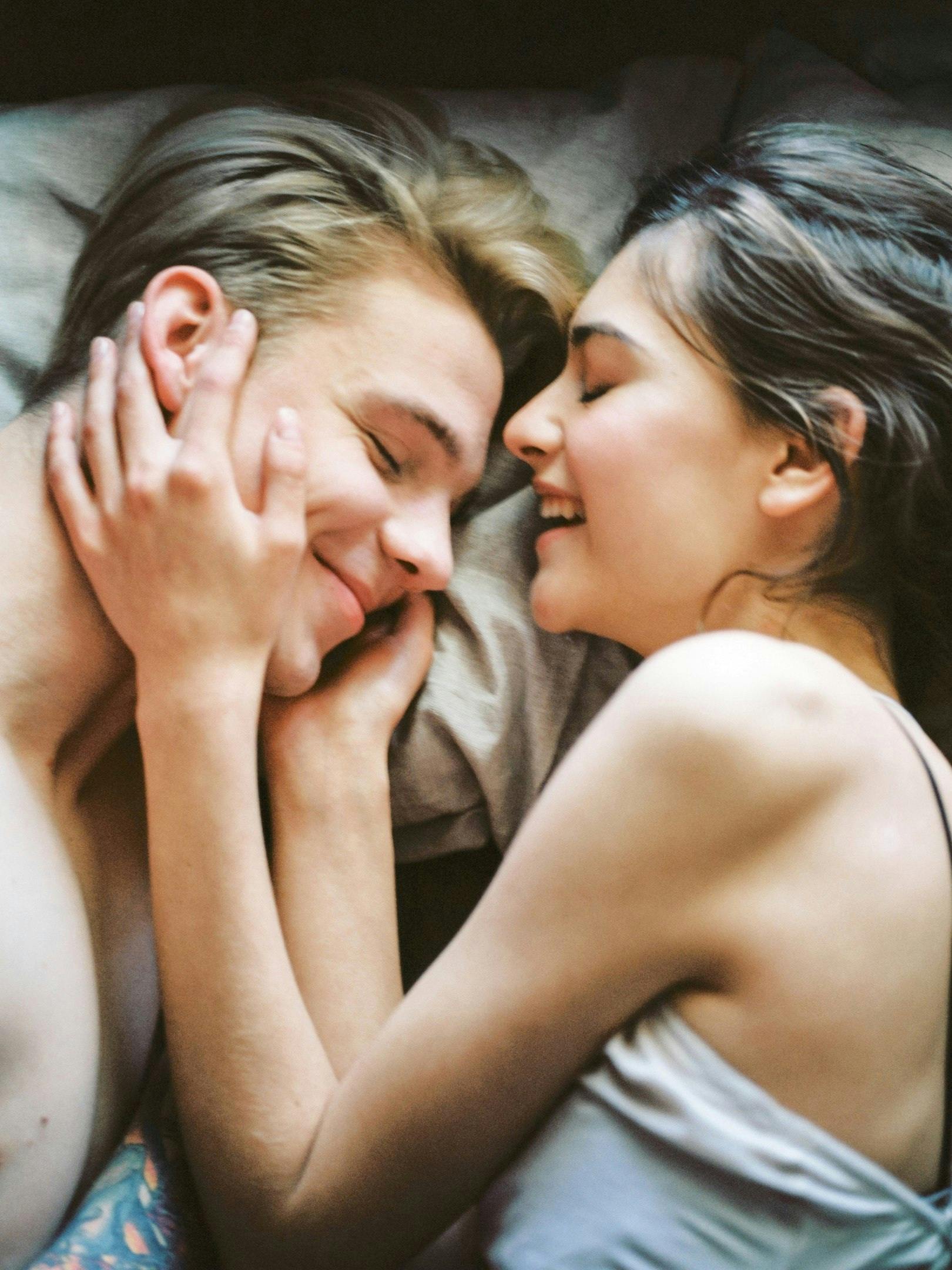 The Truth About Testosterone Boosters Science vs Hype A joyful and intimate moment of a young couple embracing and smiling together.